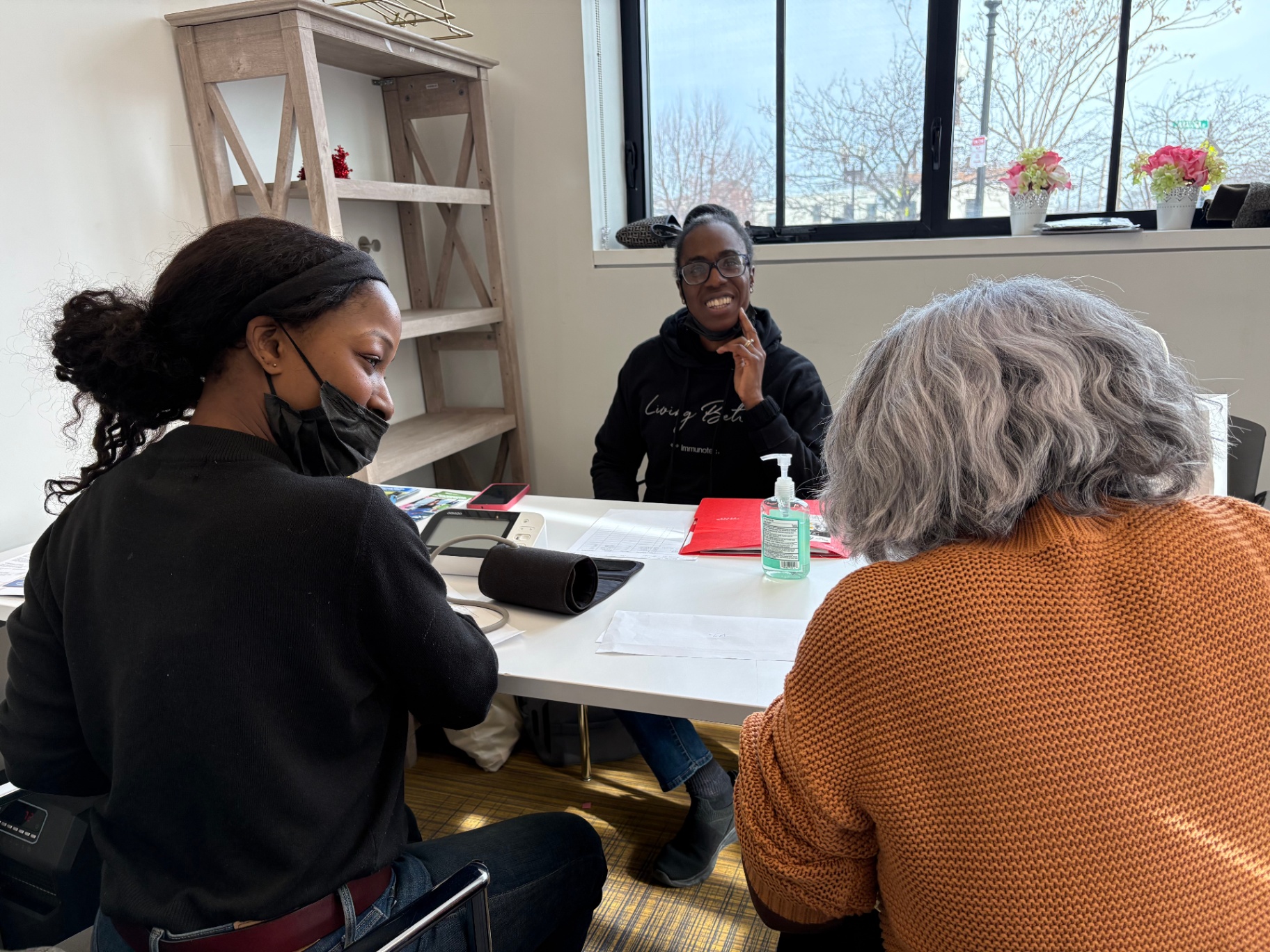Indoor screening and consultation in progress with a community member.